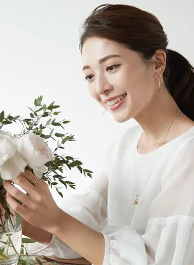 Young Japanese woman happy about Japanese skincare routine