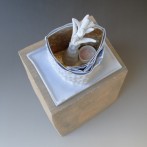 Márta Nagy; One Night on the Hill, 2009, porcelain, stoneware, silver leaf, 34x16x17cm, TerraDelft top