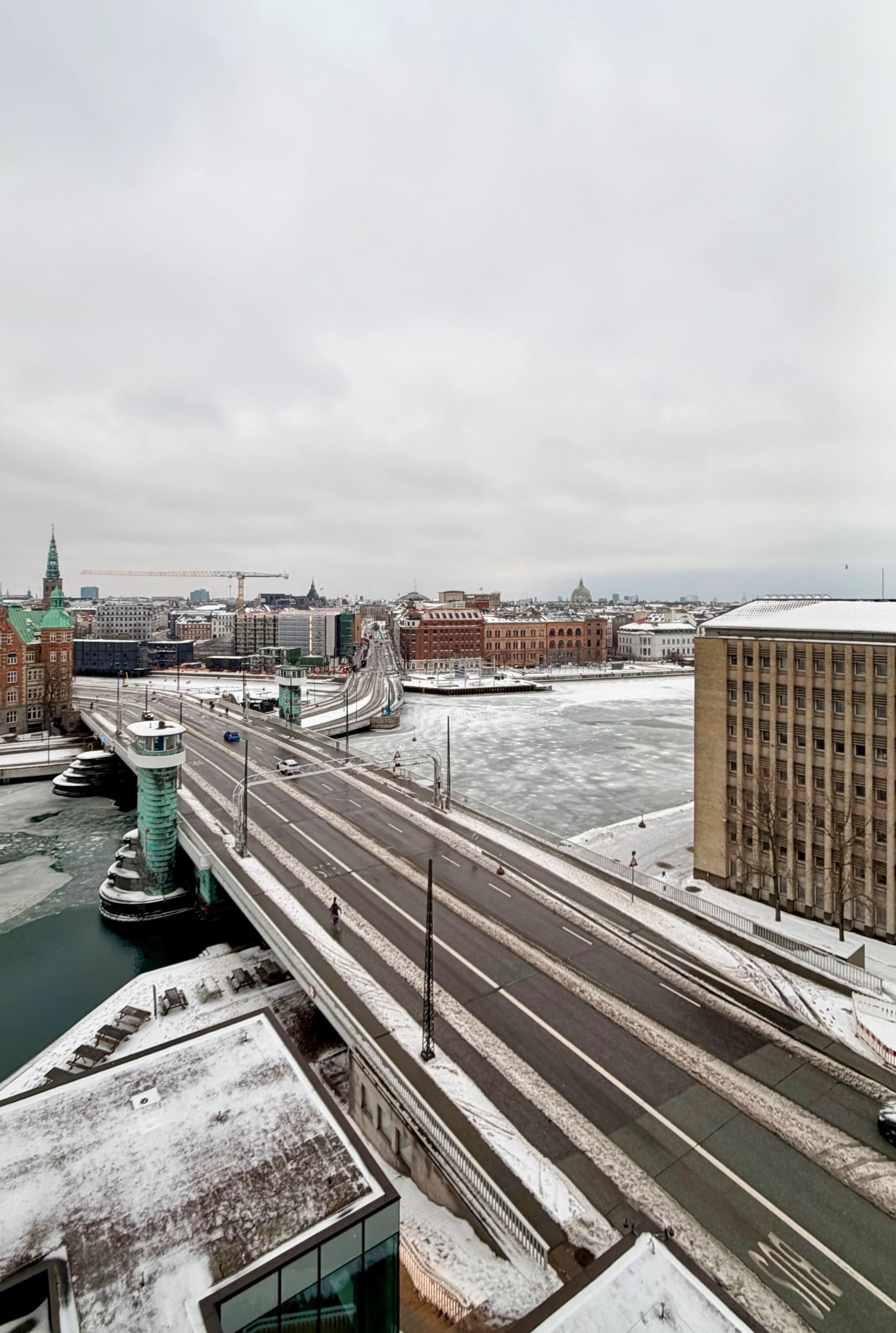 The view from my hotel window in Copenhagen looking over a bridge and an icy river.