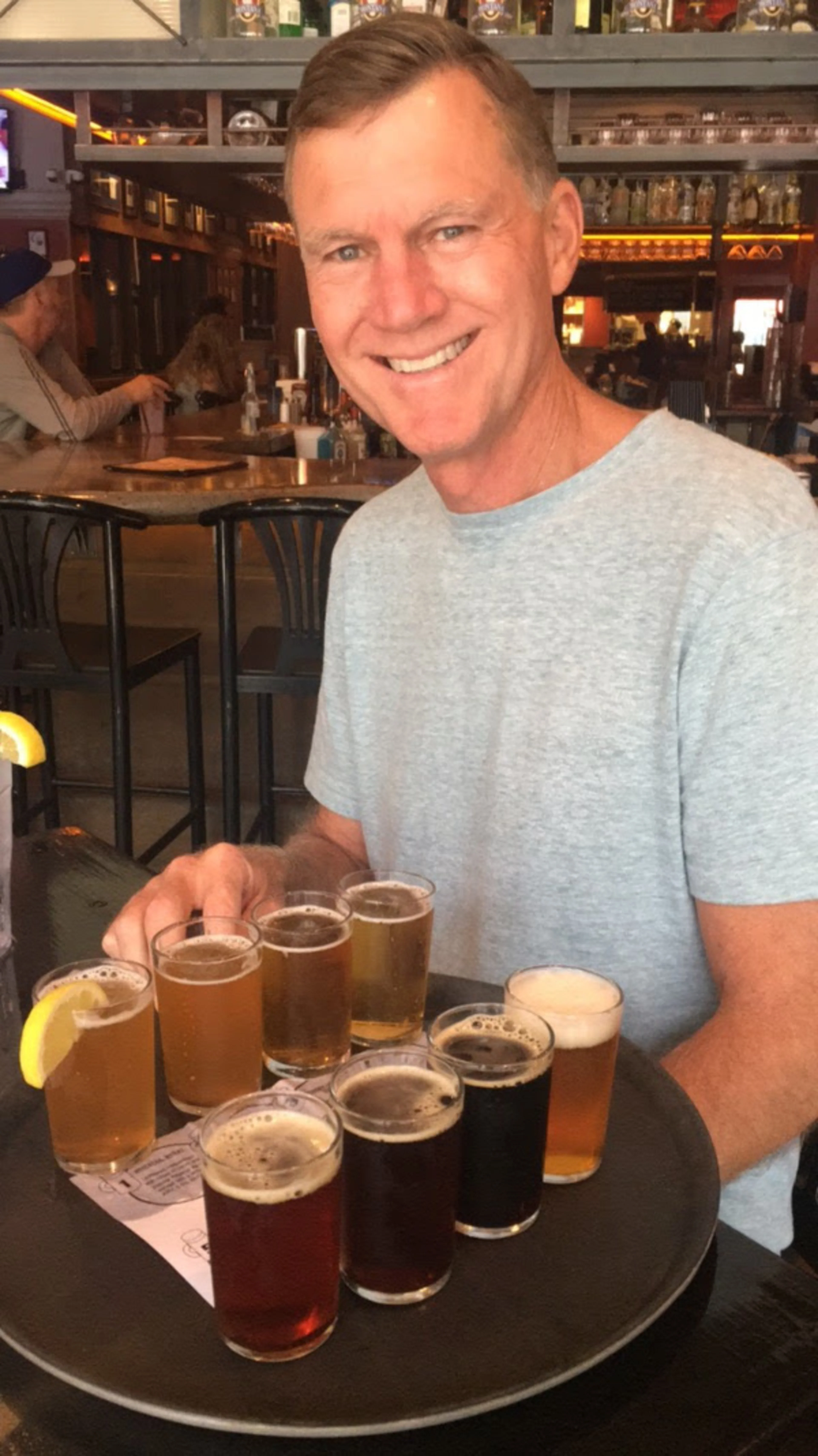 My dad with a platter of sample sized beers