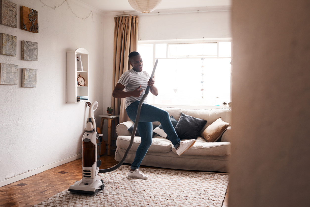 Man with a vacuum cleaner
