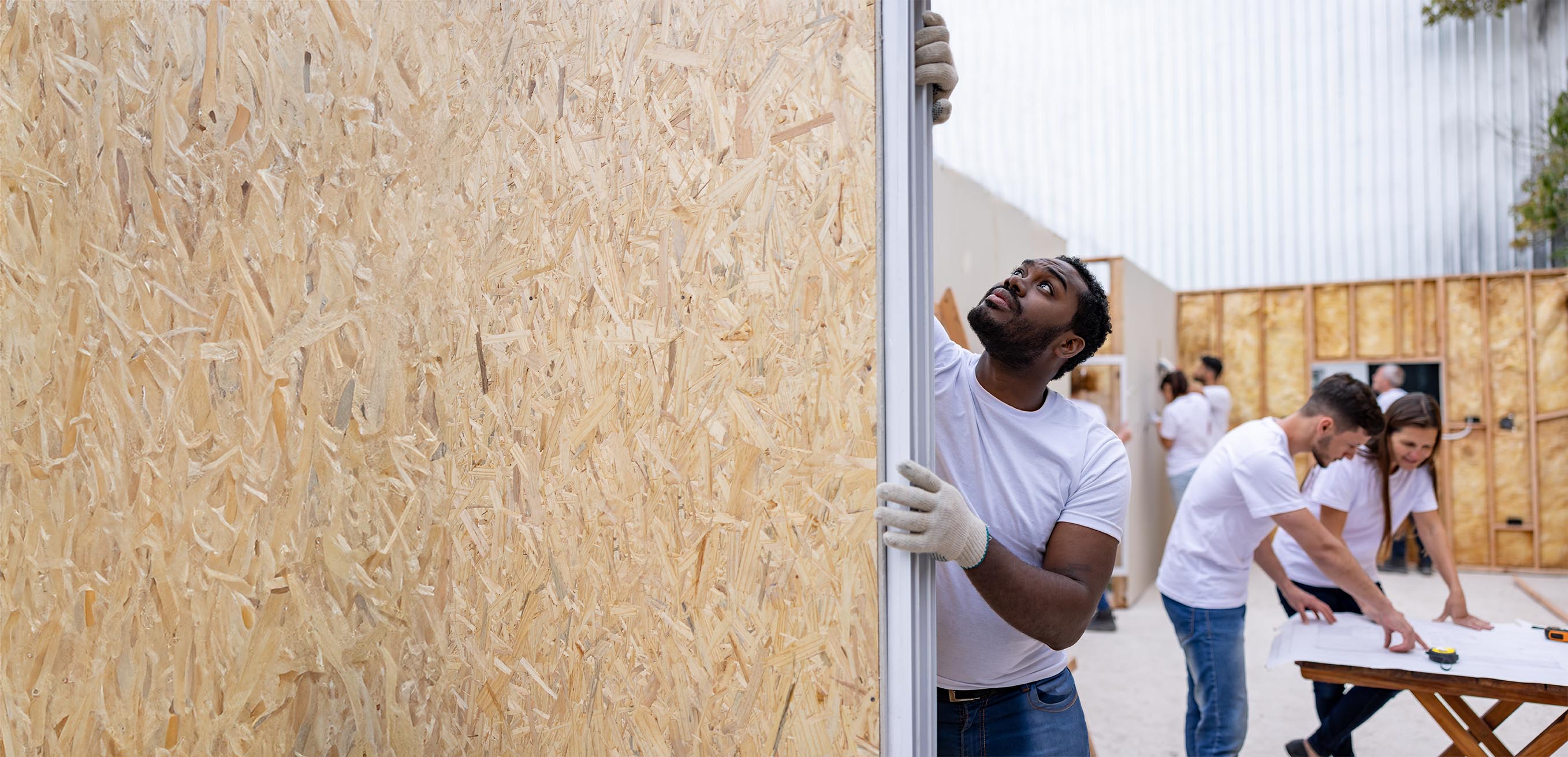 Group of people working at a building site