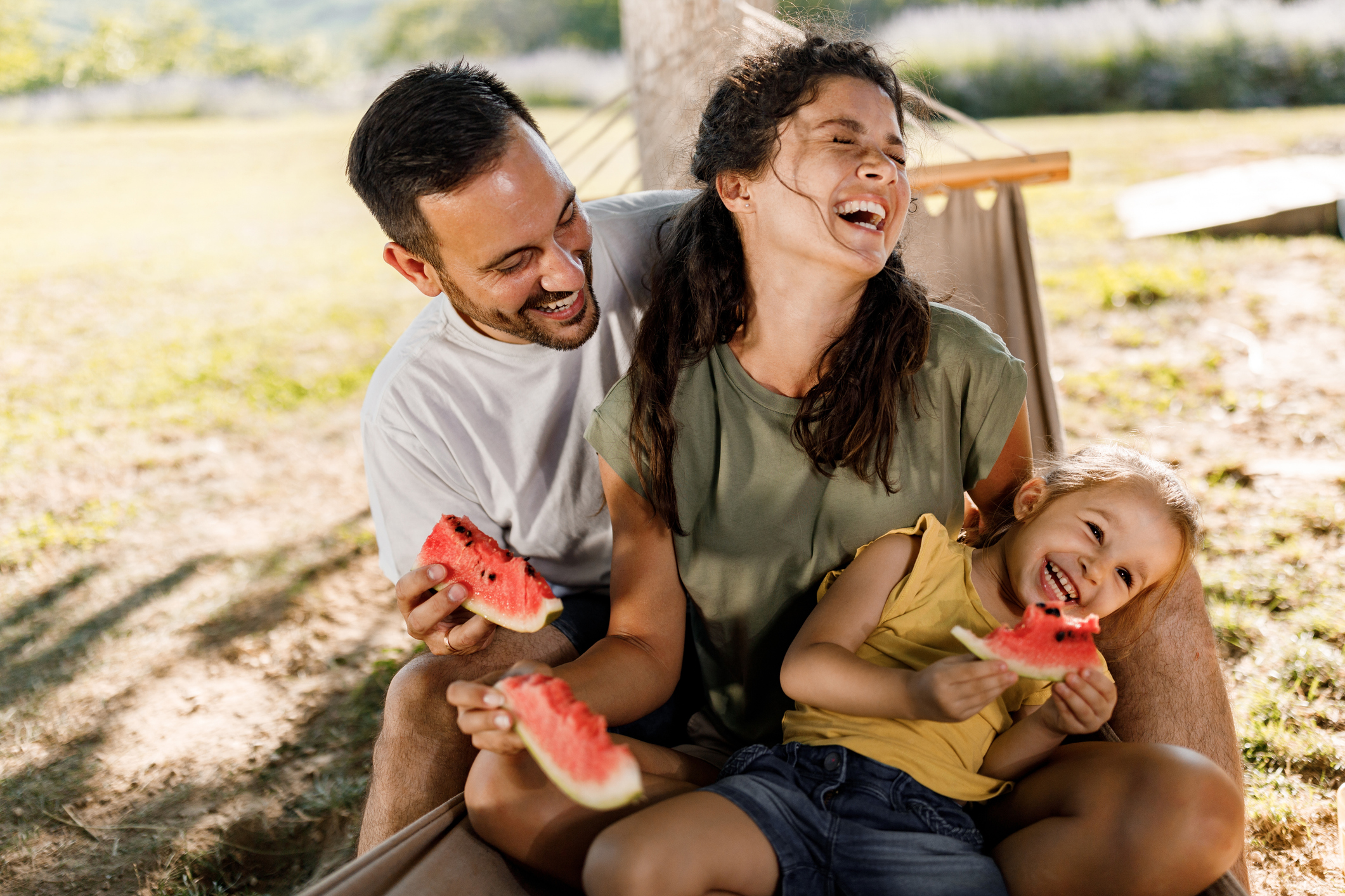 Family eating watermelon