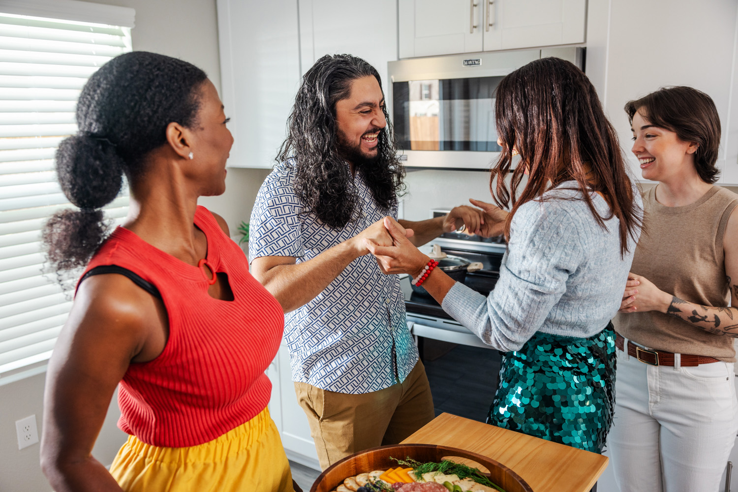 A group of friends dancing at a party.