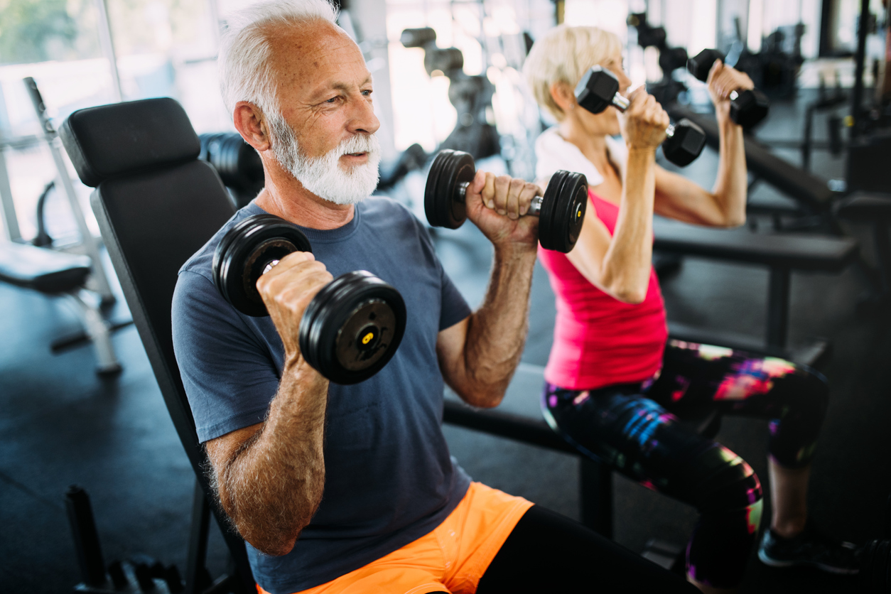 Senior citizens lifting weights