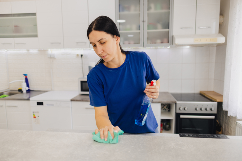 Woman cleaning counter
