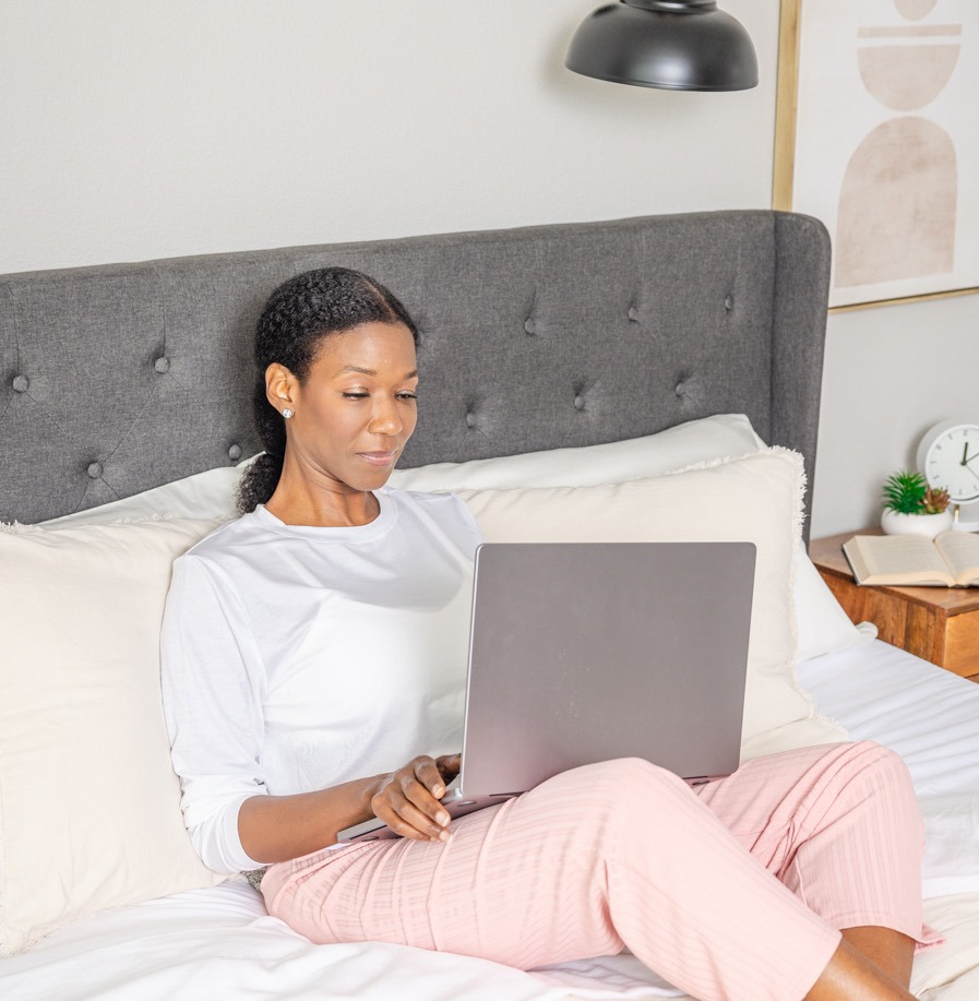 A woman uses a laptop