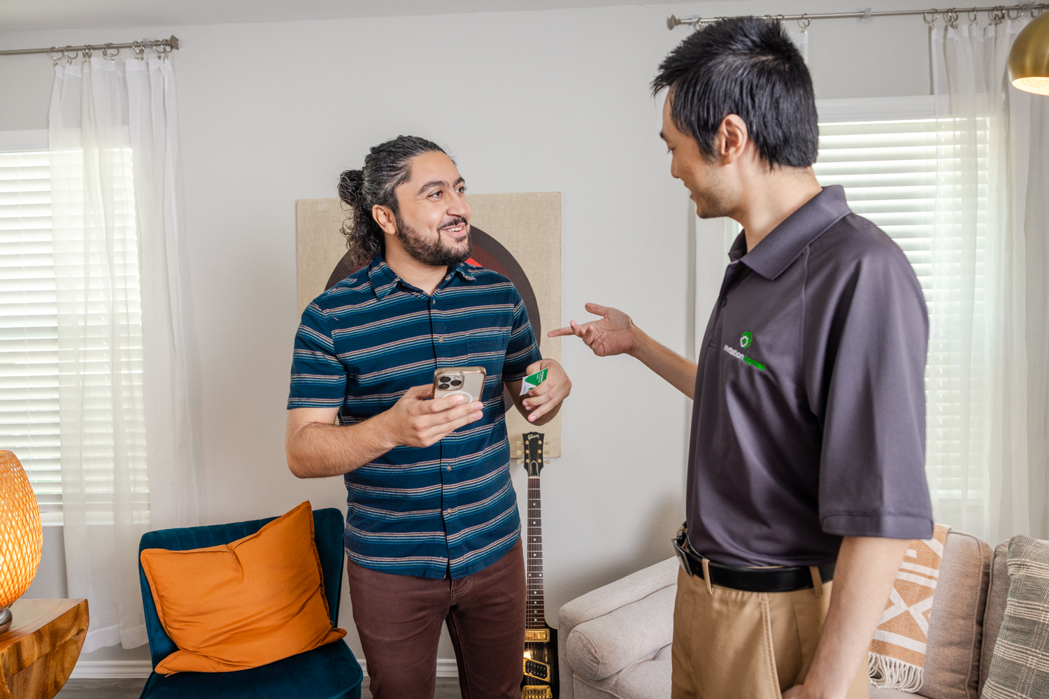 An Invitation Homes employee chats with a resident