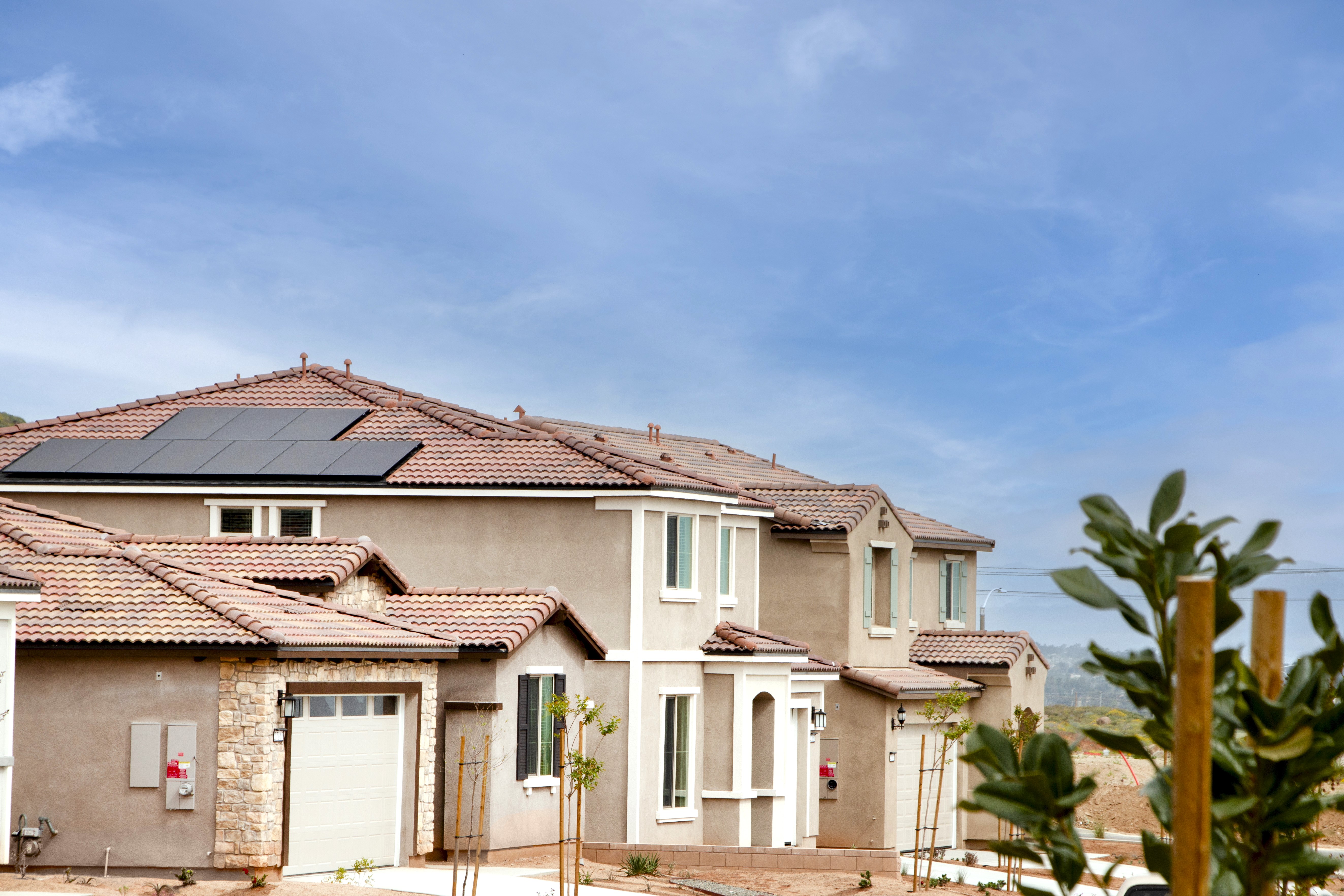 Cimarron Ridge community homes with solar panels on a street