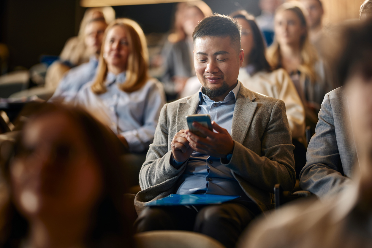 Man sitting in a crowd