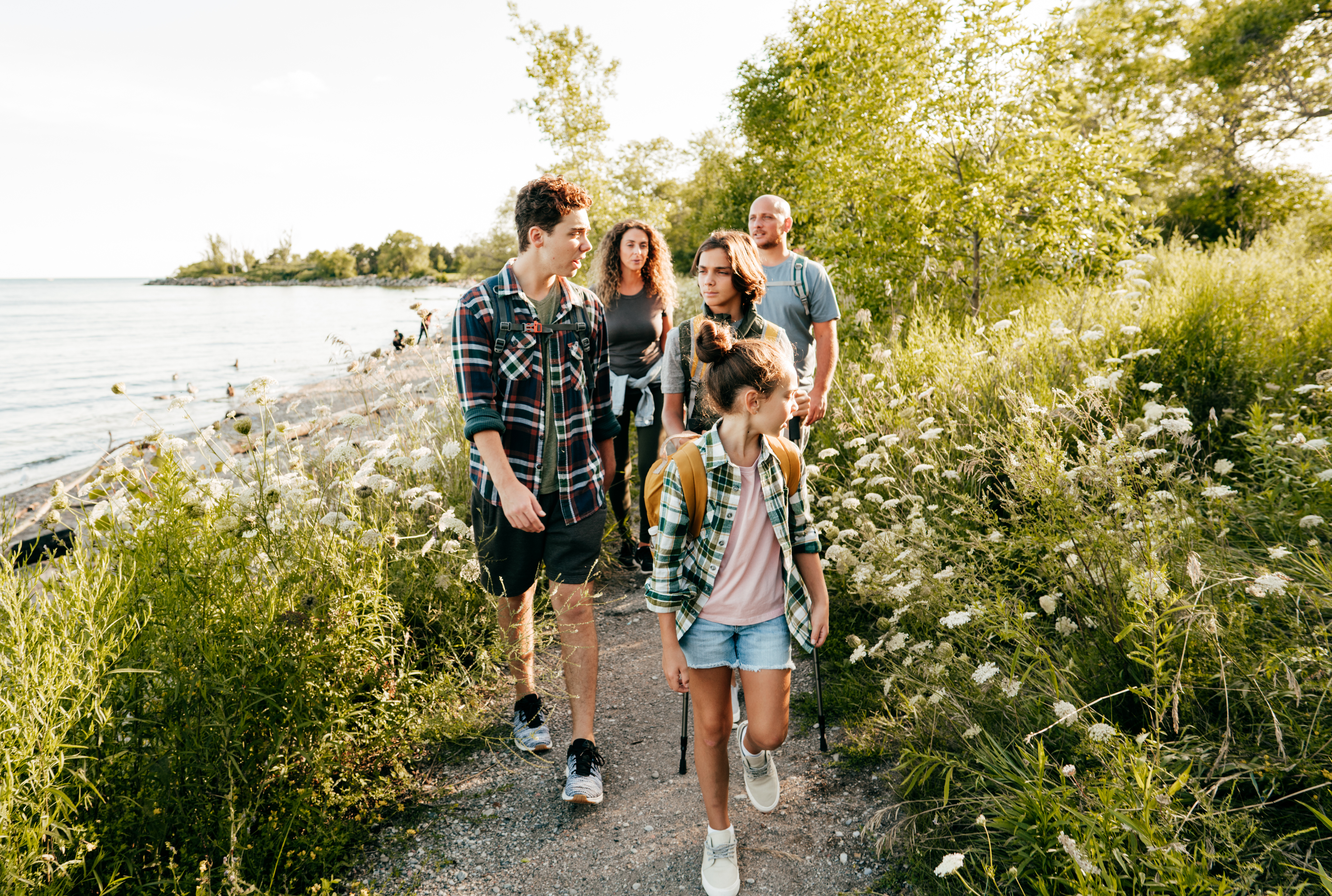 family taking a hike near a lake