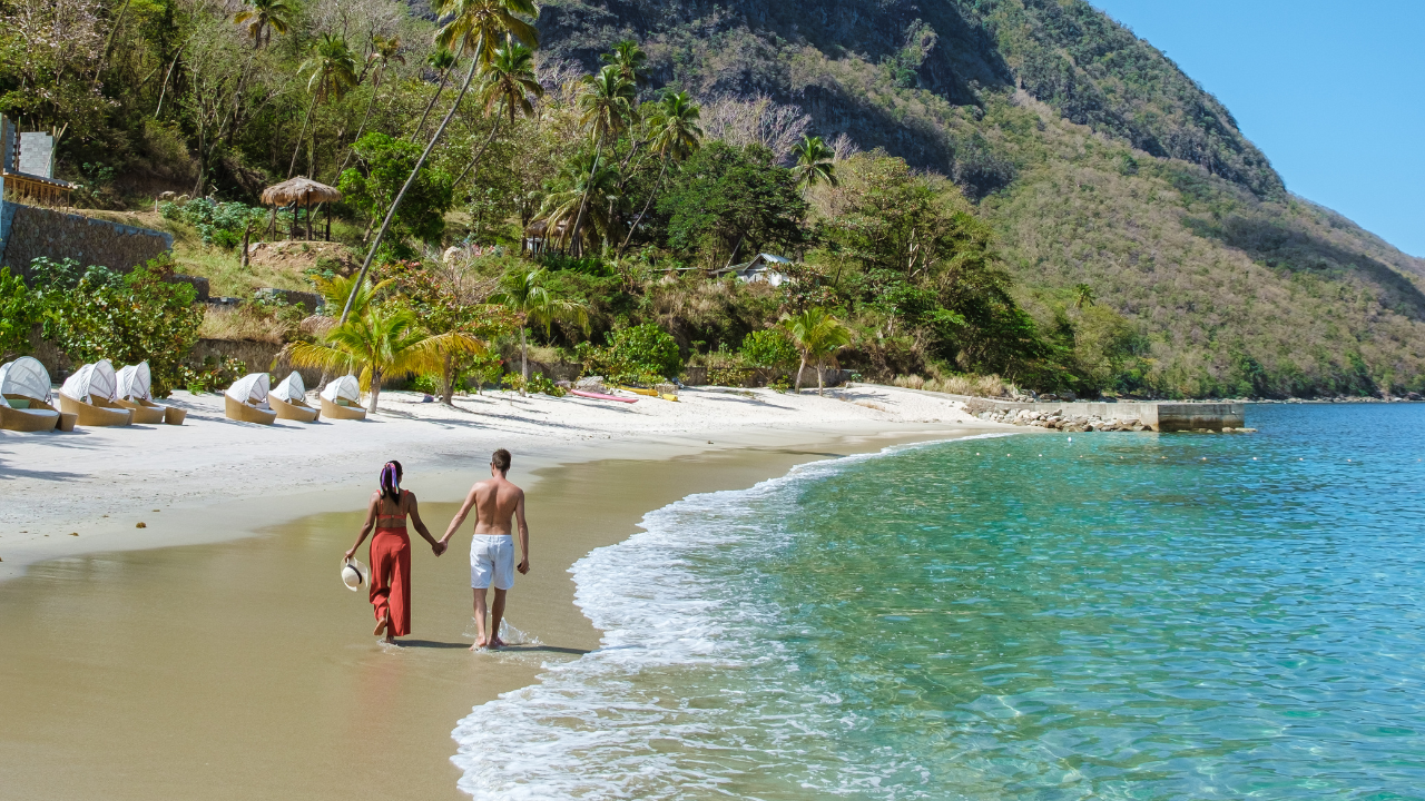 https:Spark romance in Saint Lucia! Relax on a secluded beach paradise with breathtaking views of the Pitons, and volcanic spires that symbolize the island.