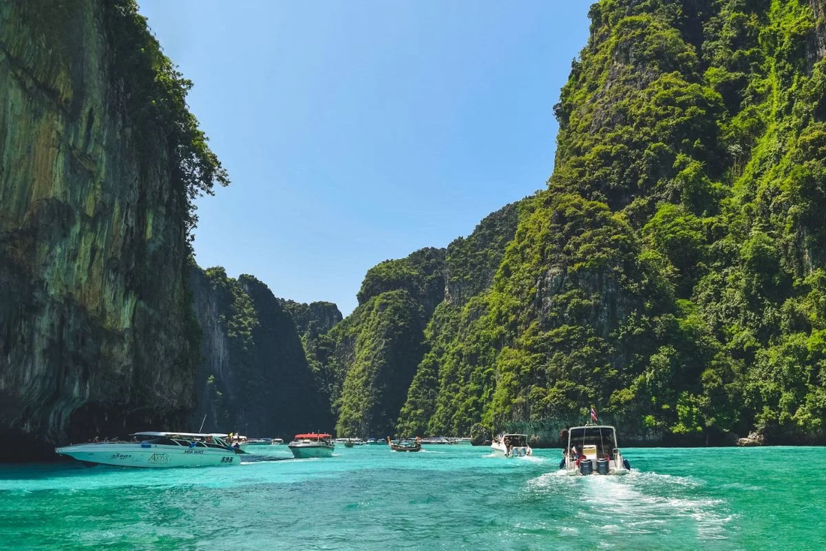 Panoramic view of Ao Nang Beach, Krabi with crystal-clear waters and towering limestone cliffs