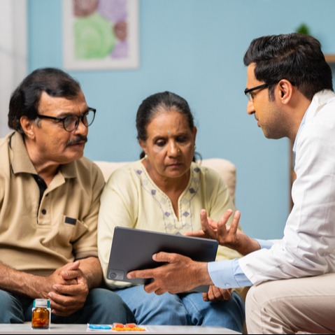 Doctor Explaining Apixaban Care via Tablet