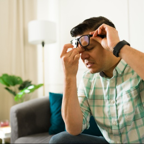 Man Struggling with Sinus Pressure at Home
