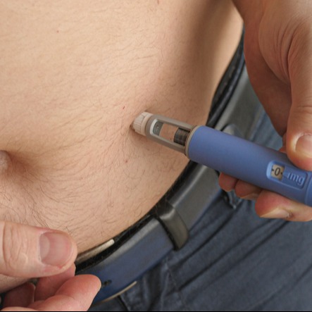 Obese fat man injecting Semaglutide