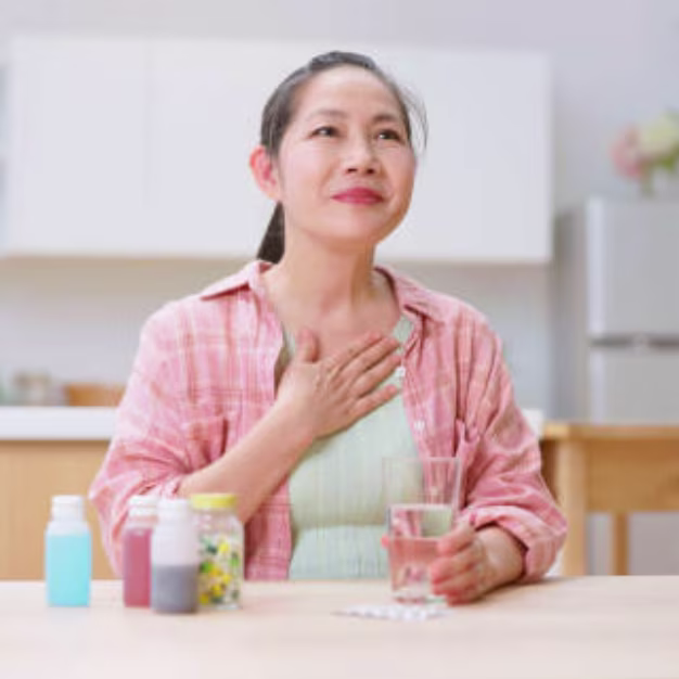 Taking Antacid for Heartburn