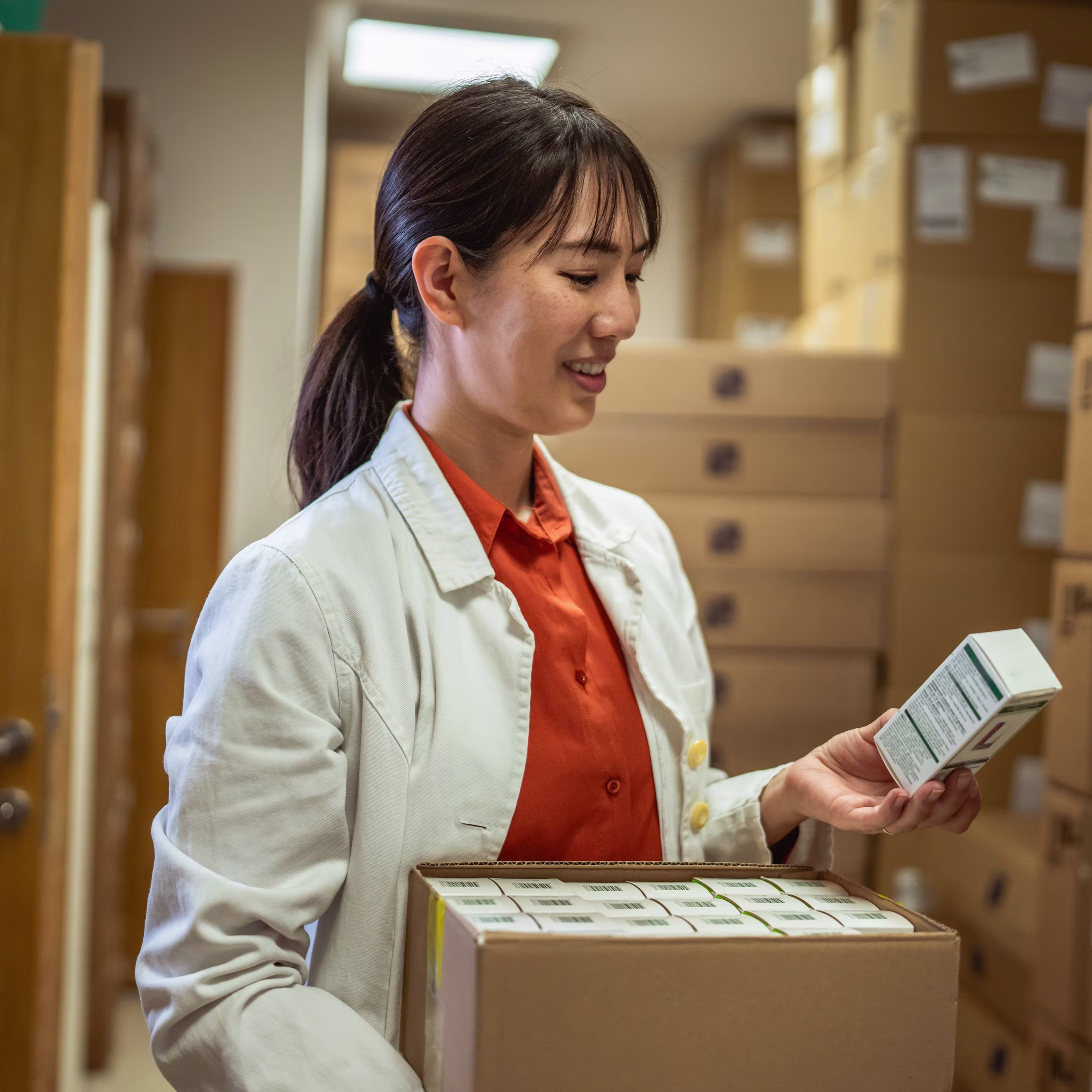 Japanese Pharmacist Checking Antacid Inventory