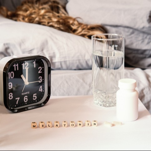 Woman Taking Melatonin for Sleep