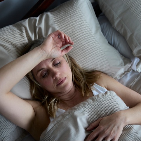 Mature woman suffering from insomnia as a side effect of Naltrexone 