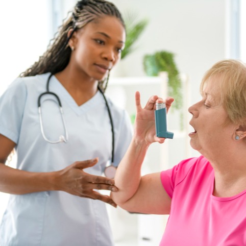 Doctor Instructing Patient on Proper Inhaler Use