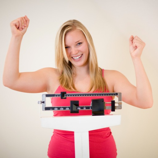 Happy woman on the scale