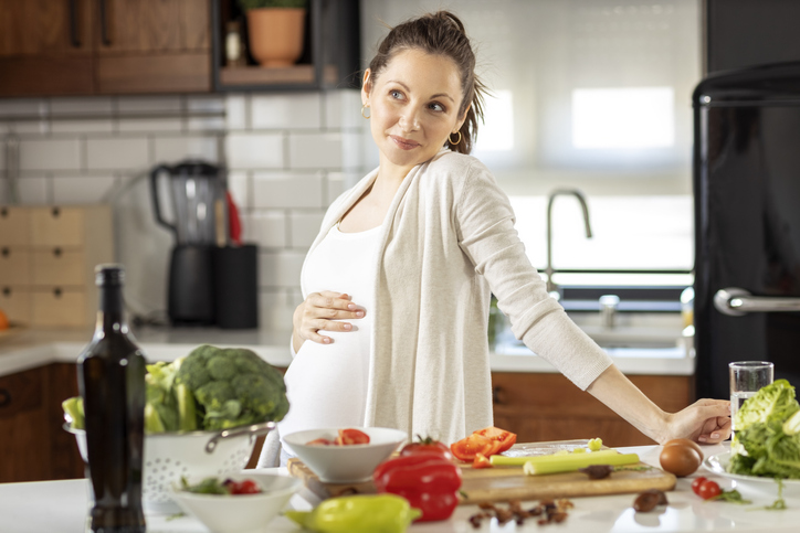 Pregnant woman in the kitchen 