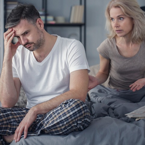 Married couple arguing in bedroom 