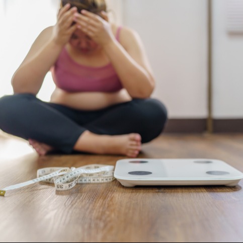 Depressed woman with weight gain due to antidepressant medication