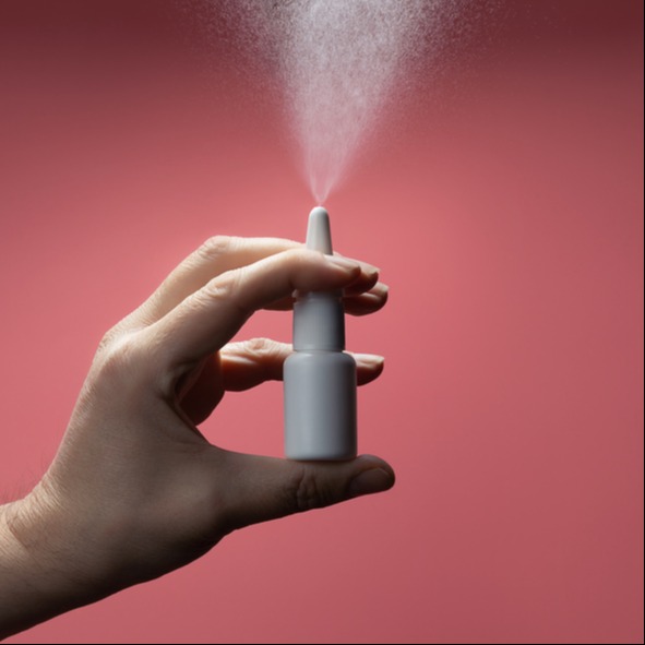 Man hand with a bottle of medication for runny nose during allergy