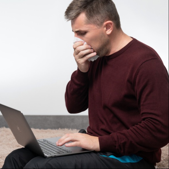 Man working from home due to respiratory allergy to the climate