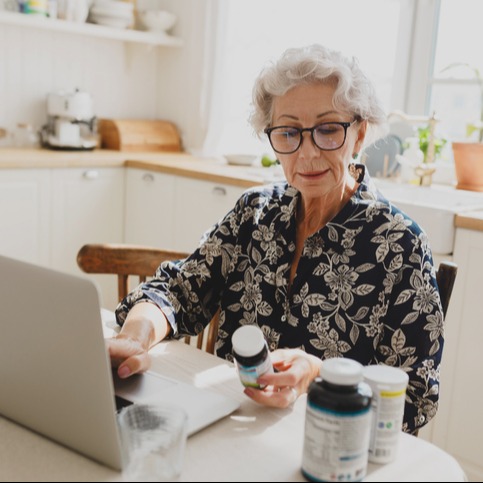 Senior Woman Reviewing Food Supplements for Personalized Health Care