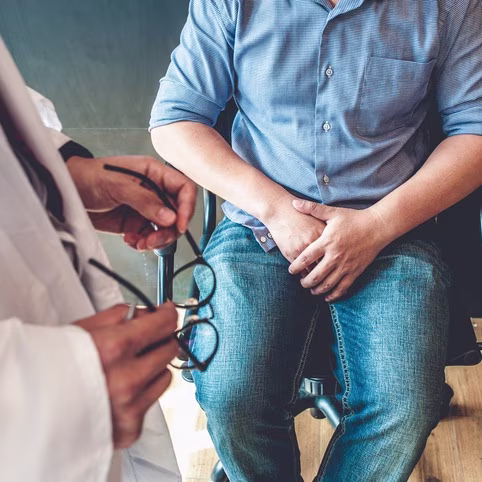 Doctors Consulting Young Men About Sexual Dysfunction and Treatment Options