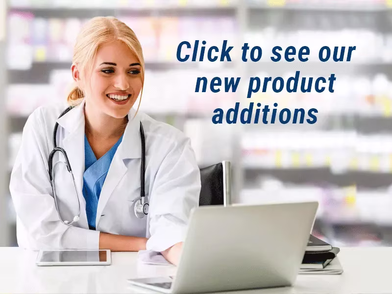 Smiling pharmacist at counter looking at laptop
