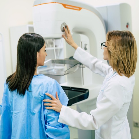 Young woman is having mammography examination at the hospital or private clinic with a professional female doctor.