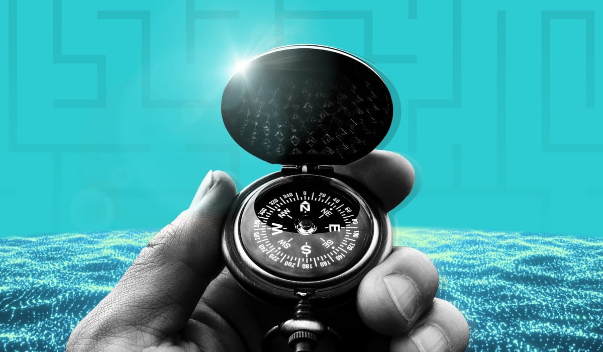 hand holding compass during workforce transformation