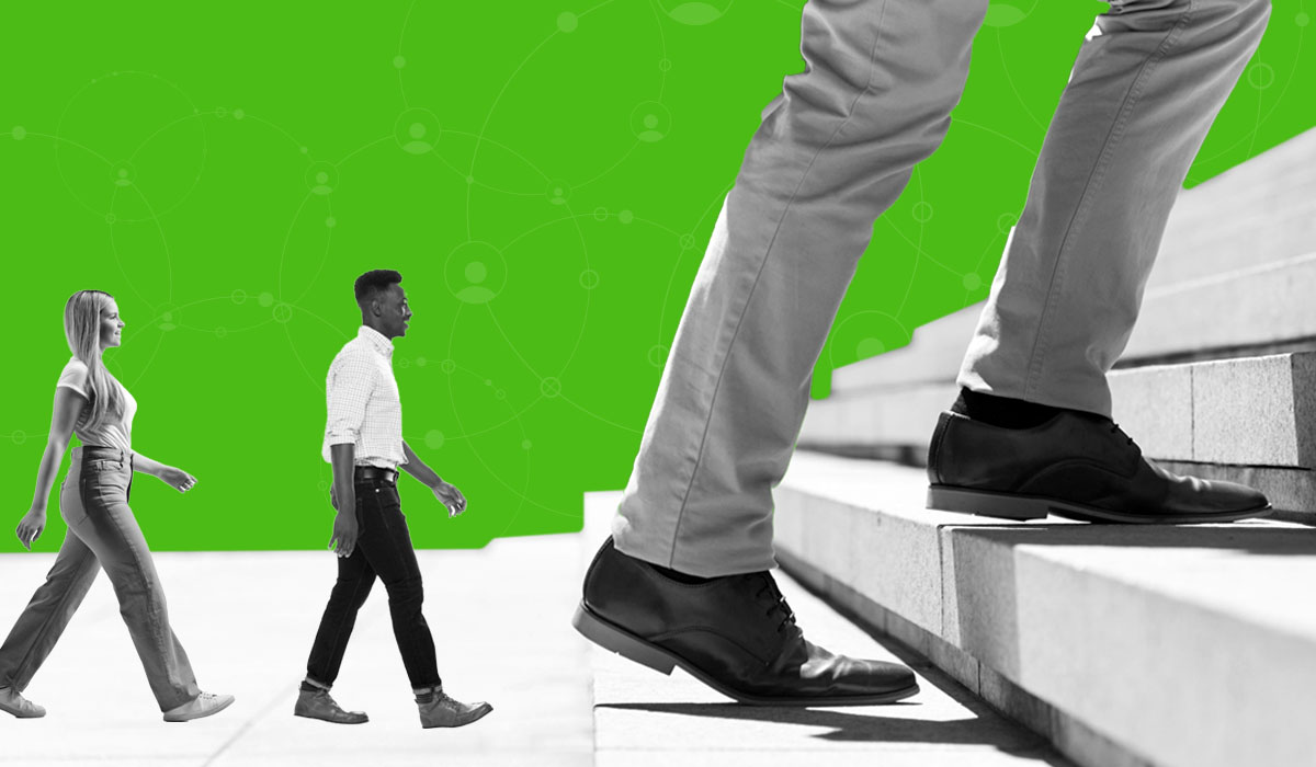 Employees walking in a line behind larger shoes to fill, representing succession planning metrics to track to identify and train successors. 