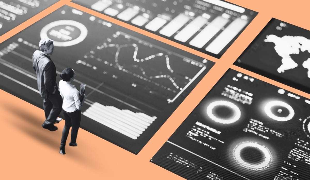 Blog header what is an HR dashboard, people standing over a dashboard