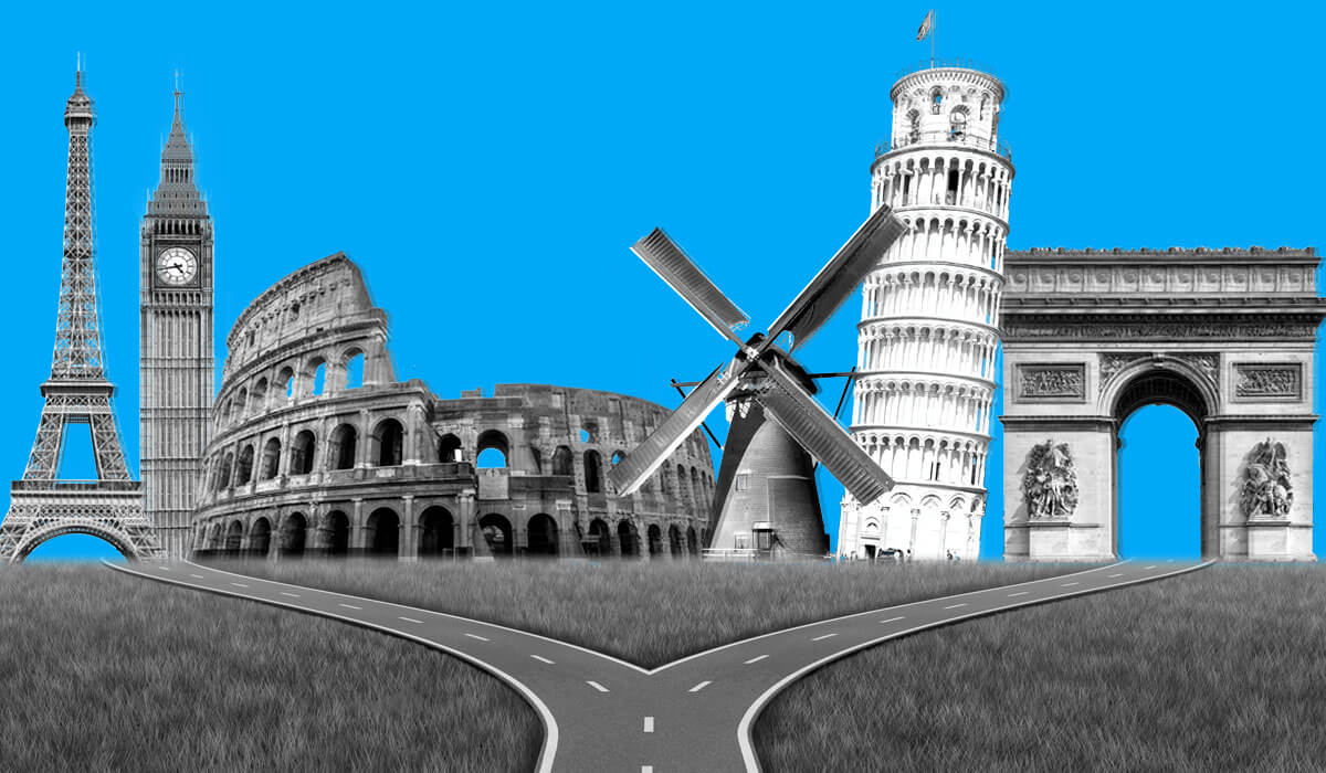 A fork in the road with famous European landmarks in the background