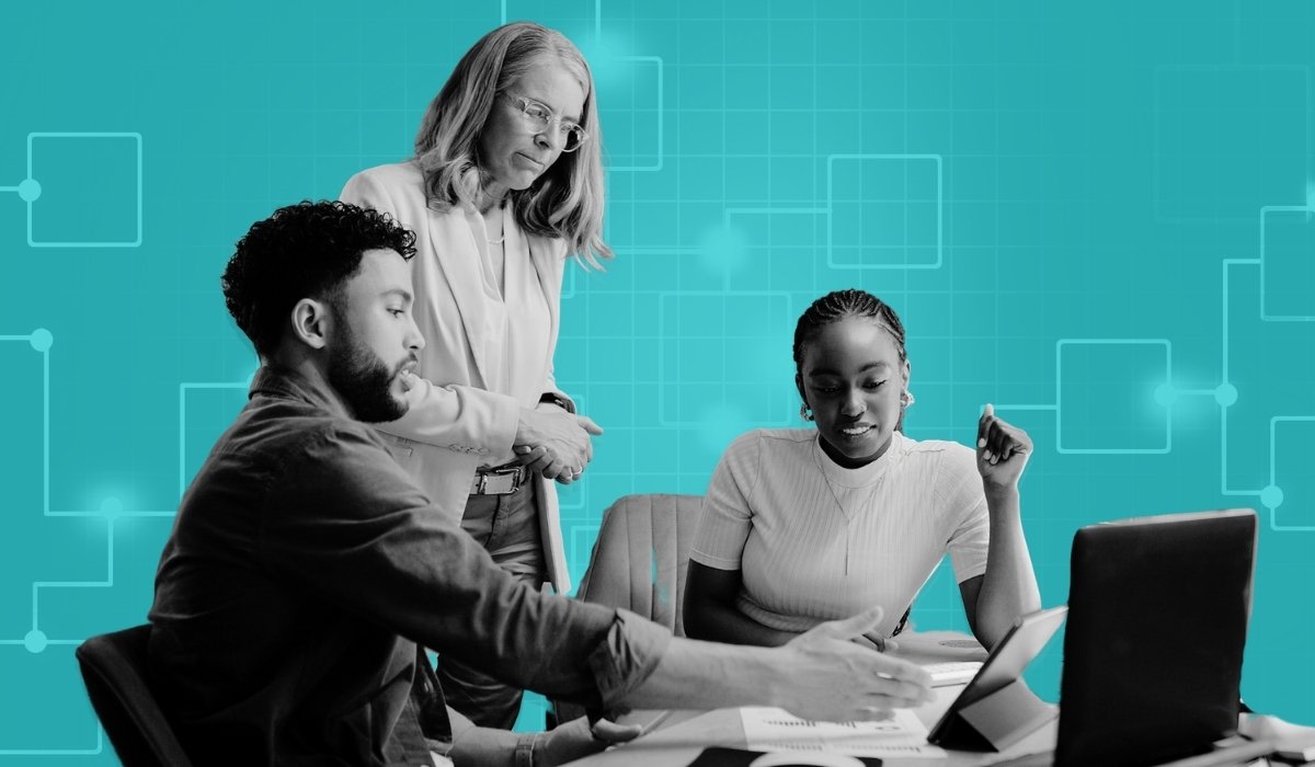three people around computer for agile organization design