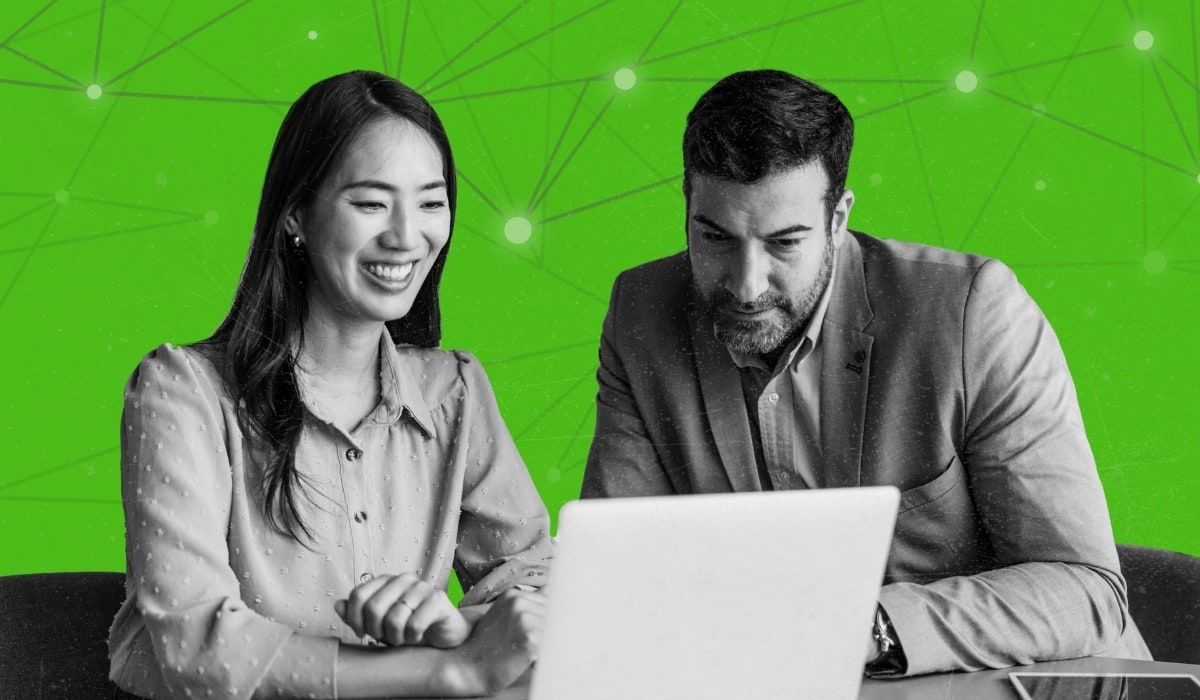 Two people building the business case for people analytics at a laptop