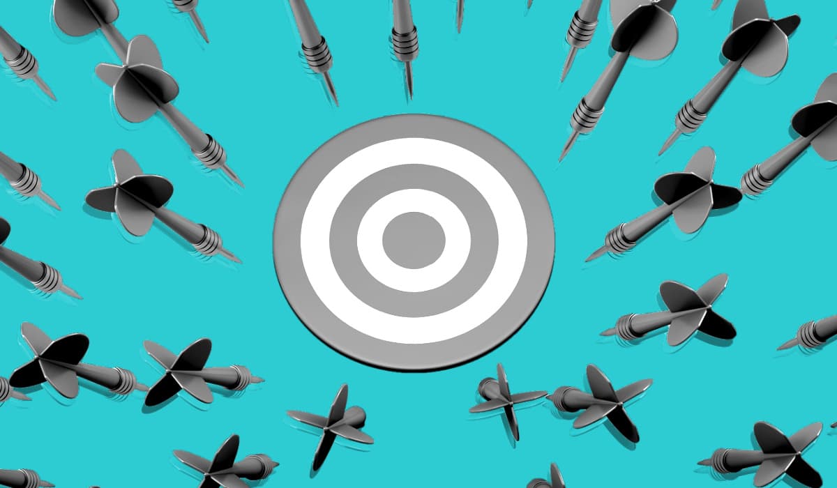 A target surrounded by incoming darts
