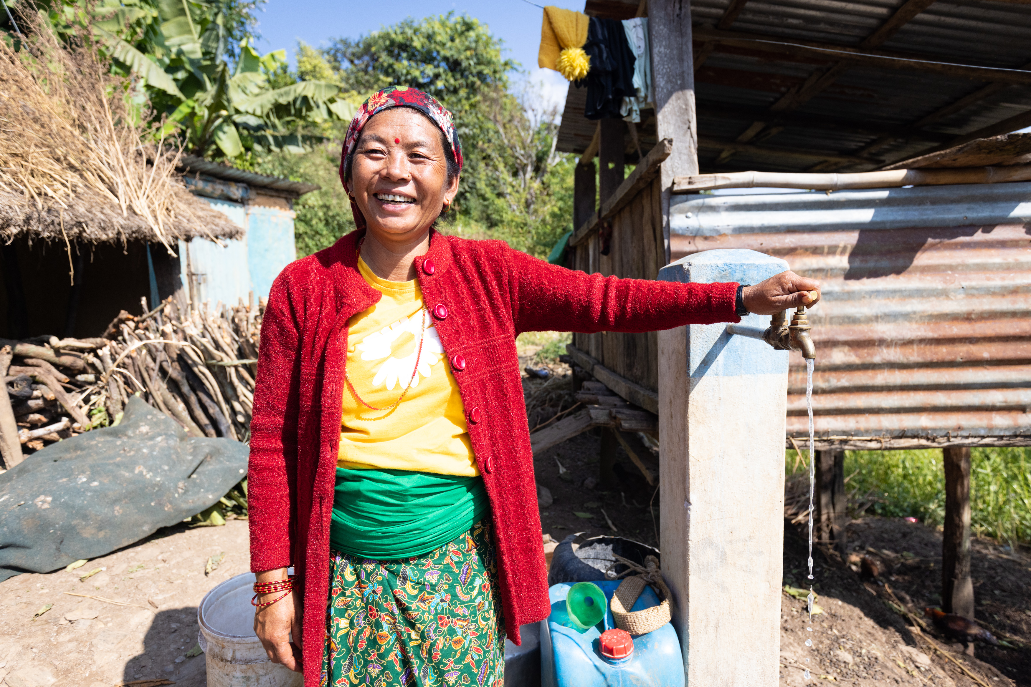 A women at a water faucet