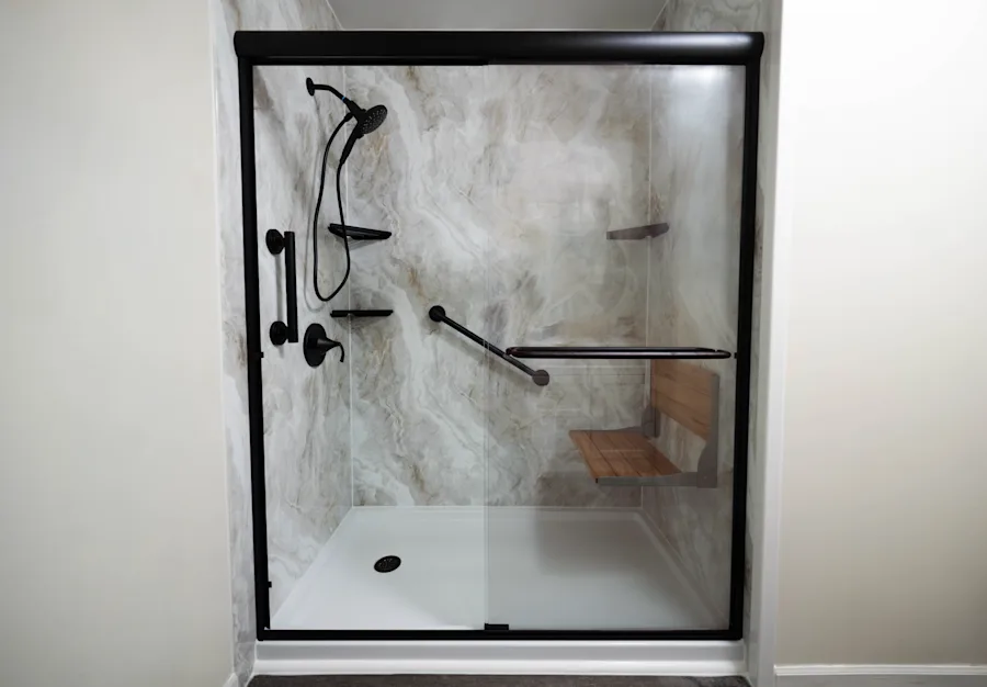 Walk-in shower with charcoal stone-look walls in a San Antonio-area home