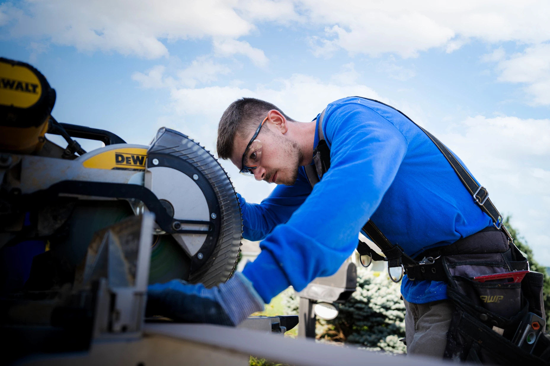 An image of an installer outside working on a flooring project.