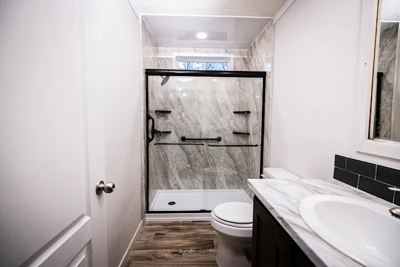 Wide view of a completed Nexa bathroom remodel with a low-threshold shower