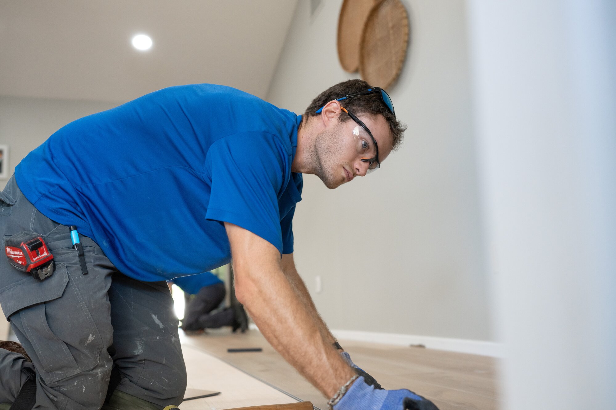 A West Shore Home installer replacing a floor in a Tampa-area home.