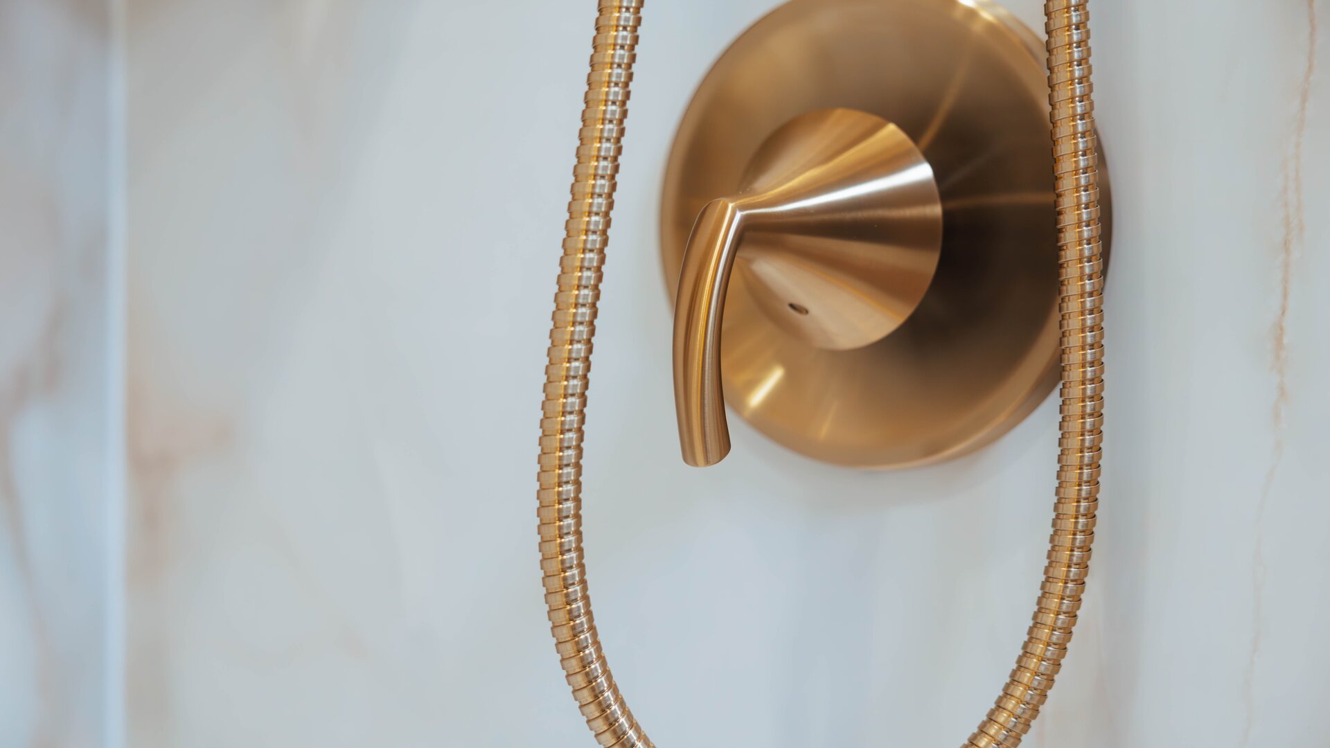 Spa-style Nexa walk-in shower with bronzed gold fixtures