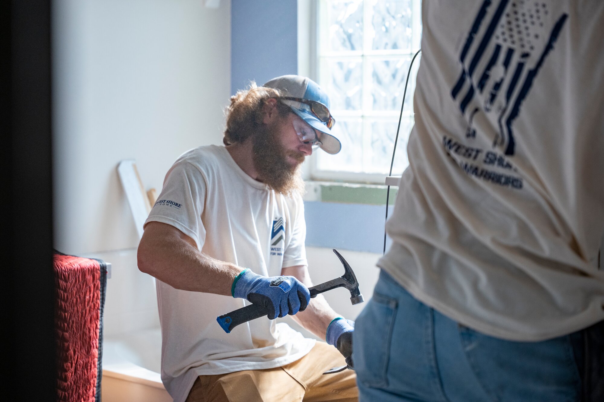 West Shore Home employee working on veterans new bathroom 