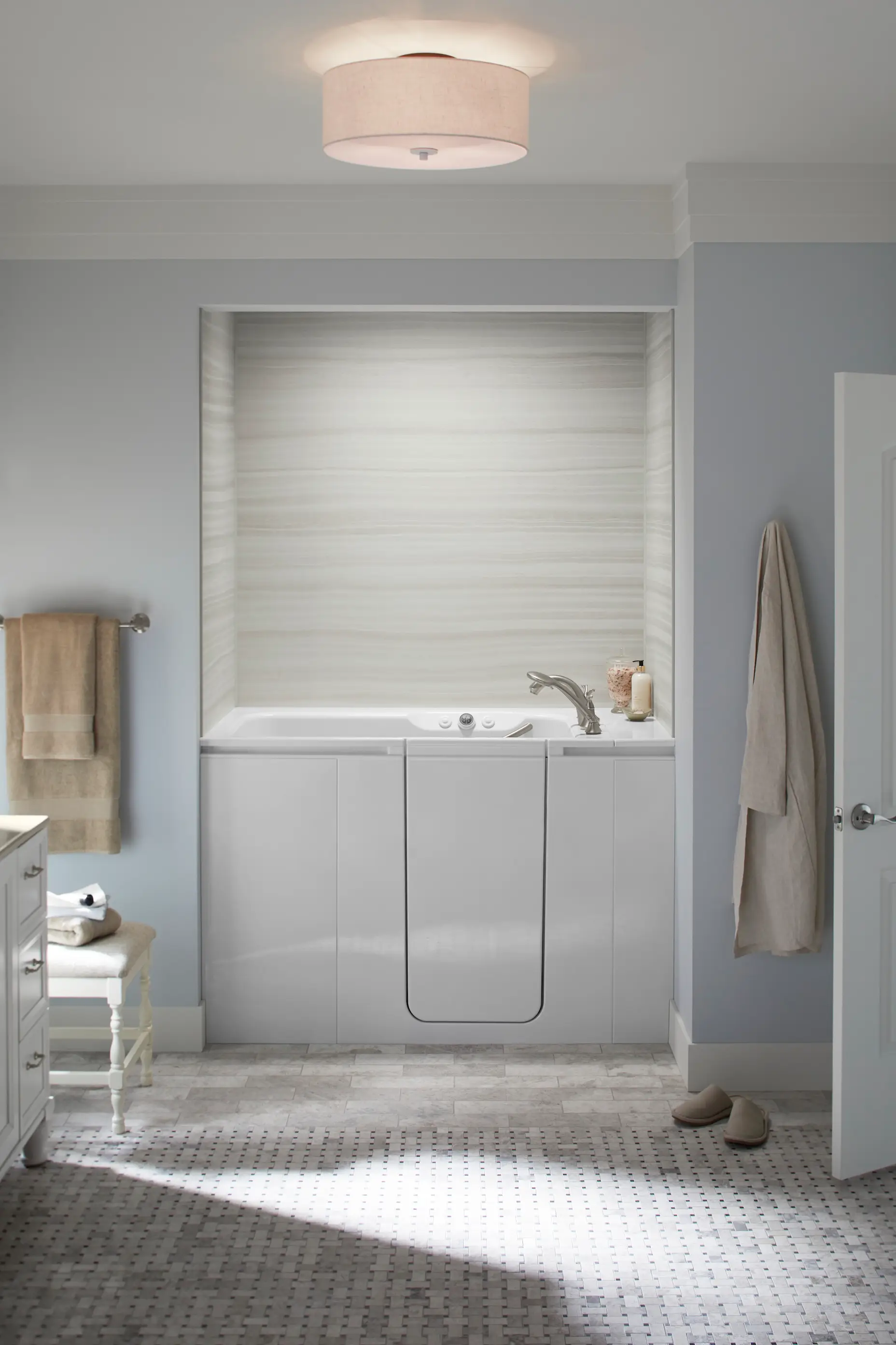 A white walk-in tub in a neutral bathroom.